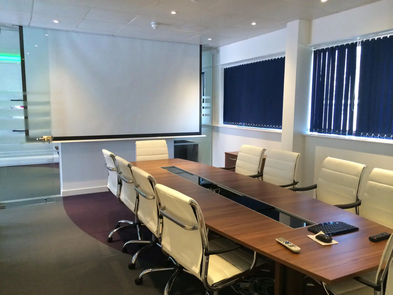 PEL UK Offices space with designer furniture and wall mounted digital screens